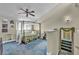 Bedroom featuring a vaulted ceiling, large window, and canopy bed, offering a peaceful retreat at 5157 Garden Ln # F, Las Vegas, NV 89119