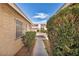 Exterior view of walkway leading to the front door of the home at 5157 Garden Ln # F, Las Vegas, NV 89119