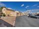 Multiple car garages in a community with well-maintained landscaping and parking spots at 5157 Garden Ln # F, Las Vegas, NV 89119