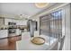 Eat-in kitchen with updated stainless appliances and seating near the sliding door at 5157 Garden Ln # F, Las Vegas, NV 89119