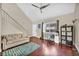 Bright living room with vaulted ceilings, wood floors, staircase and front door at 5157 Garden Ln # F, Las Vegas, NV 89119