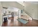 Bright living room with vaulted ceilings, wood floors, view to kitchen and dining area at 5157 Garden Ln # F, Las Vegas, NV 89119