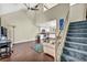 Bright living room with vaulted ceilings, ceiling fan, wood floors and open to the kitchen at 5157 Garden Ln # F, Las Vegas, NV 89119