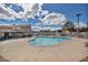 Community pool with lounge chairs and well-maintained landscaping, perfect for relaxation at 5157 Garden Ln # F, Las Vegas, NV 89119