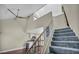 Spacious staircase leading to the upper level, offering a view of the kitchen and a glimpse of the home's layout at 5157 Garden Ln # F, Las Vegas, NV 89119