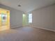 Spacious bedroom features neutral carpet and access to an ensuite bathroom and closet at 5161 Lindell Rd # 104, Las Vegas, NV 89118
