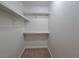 Walk-in closet with multiple shelves and hanging rods offers great storage solutions at 5161 Lindell Rd # 104, Las Vegas, NV 89118