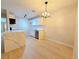 Well-lit kitchen featuring quartz countertop island and efficient stainless steel dishwasher at 5161 Lindell Rd # 104, Las Vegas, NV 89118