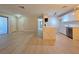 Bright kitchen with quartz countertop island open to the living area and stainless steel dishwasher at 5161 Lindell Rd # 104, Las Vegas, NV 89118