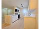 Corner view of kitchen with stainless steel appliances, stone countertop island and modern cabinets at 5161 Lindell Rd # 104, Las Vegas, NV 89118