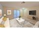 Inviting living room featuring a white sofa, stylish rug, and sliding glass doors for plenty of natural light at 5161 Lindell Rd # 104, Las Vegas, NV 89118