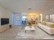 Inviting living room featuring an open-concept layout, a cozy sofa, and modern decor at 5161 Lindell Rd # 104, Las Vegas, NV 89118