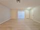Spacious living room showcasing modern flooring, sliding glass doors, and ample natural light at 5161 Lindell Rd # 104, Las Vegas, NV 89118