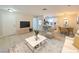 Bright living room showcasing an open floorplan, modern furnishings, and hardwood-style floors at 5161 Lindell Rd # 104, Las Vegas, NV 89118