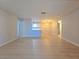 Open-concept living space featuring modern flooring and convenient access to the kitchen at 5161 Lindell Rd # 104, Las Vegas, NV 89118