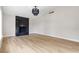 Bright living room featuring a fireplace and light wood flooring at 5832 Arandas Ct, Las Vegas, NV 89103