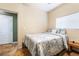 Well-lit bedroom with neutral walls, a comfortable bed, and tile floors at 6177 W Cougar Ave, Las Vegas, NV 89139