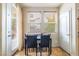 Bright breakfast nook with a marble top table, two chairs, and a view of the patio at 6177 W Cougar Ave, Las Vegas, NV 89139