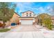 Charming two-story home featuring a paved driveway and a well-maintained front yard at 6177 W Cougar Ave, Las Vegas, NV 89139