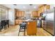 Functional kitchen with stainless steel appliances, granite countertops and a center island at 6177 W Cougar Ave, Las Vegas, NV 89139