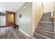 Entryway featuring a staircase with wood and grey wood laminate flooring, leading to the upper level at 6177 W Cougar Ave, Las Vegas, NV 89139