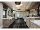 Luxurious bathroom with dual vanities, mirrors, and modern shower at 64 Promontory Ridge Dr, Las Vegas, NV 89135