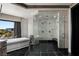 Bathroom showing stand alone tub, glass shower, and exterior view at 64 Promontory Ridge Dr, Las Vegas, NV 89135