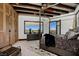 Bright bedroom featuring a four-poster bed, beamed ceilings, and a window with a view at 64 Promontory Ridge Dr, Las Vegas, NV 89135