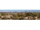 Sweeping panoramic view of the city skyline from a residential area, highlighting the urban landscape at 64 Promontory Ridge Dr, Las Vegas, NV 89135