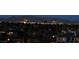 Distant city views and mountain backdrops offer a serene ambiance in the evenings at 64 Promontory Ridge Dr, Las Vegas, NV 89135
