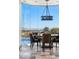 Dining room features a round table, city views, and sleek chandelier at 64 Promontory Ridge Dr, Las Vegas, NV 89135