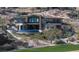 Luxury home with a private infinity pool overlooking a golf course, showcasing elegant architecture and design at 64 Promontory Ridge Dr, Las Vegas, NV 89135