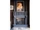 Elegant fireplace with stone mantle, decorative art and hardwood accent wall at 64 Promontory Ridge Dr, Las Vegas, NV 89135