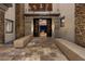 Grand entrance features a stone walkway, water feature, and custom double doors at 64 Promontory Ridge Dr, Las Vegas, NV 89135