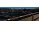 Enjoy the view of the golf course and the city lights from the backyard balcony at 64 Promontory Ridge Dr, Las Vegas, NV 89135