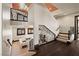 Bright hallway featuring unique railings, hardwood floors, and staircase access at 64 Promontory Ridge Dr, Las Vegas, NV 89135
