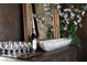 Interior shot of a decorative table with wine, glassware, and floral arrangement at 64 Promontory Ridge Dr, Las Vegas, NV 89135