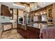 Spacious kitchen featuring granite counters, custom cabinetry, and high-end appliances at 64 Promontory Ridge Dr, Las Vegas, NV 89135