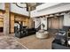 Expansive living room featuring high ceilings, stone accents and comfortable furnishings at 64 Promontory Ridge Dr, Las Vegas, NV 89135