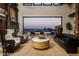Expansive living area with luxurious seating and seamless indoor-outdoor flow to the pool at 64 Promontory Ridge Dr, Las Vegas, NV 89135