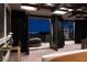 View from main bedroom to outdoor patio showing lounge seating and city view at 64 Promontory Ridge Dr, Las Vegas, NV 89135
