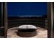 Outdoor patio featuring lounge seating and views of the city skyline at 64 Promontory Ridge Dr, Las Vegas, NV 89135