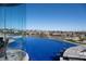 Infinity pool with an amazing view of the golf course and mountains at 64 Promontory Ridge Dr, Las Vegas, NV 89135