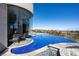 Stunning infinity pool with dining area and city views surrounded by modern architecture at 64 Promontory Ridge Dr, Las Vegas, NV 89135