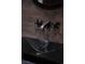 Close up of powder room sink with custom faucet and natural wood paneling at 64 Promontory Ridge Dr, Las Vegas, NV 89135