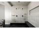 Luxurious bathroom with dual shower heads, marble tiling, and a built-in bench for a spa-like experience at 64 Promontory Ridge Dr, Las Vegas, NV 89135