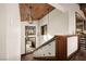 Elegant staircase with wooden steps, decorative lighting, and an open design, adding architectural interest at 64 Promontory Ridge Dr, Las Vegas, NV 89135