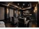 Private home theater with comfortable seating, a large screen, and sophisticated design for immersive entertainment at 64 Promontory Ridge Dr, Las Vegas, NV 89135