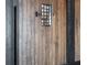Heavy, varnished wood door with what looks like a speaking window and a black metal frame at 64 Promontory Ridge Dr, Las Vegas, NV 89135