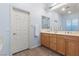 Bathroom with a double sink vanity, bath and shower at 7232 Frontier Hills Ave, Las Vegas, NV 89113